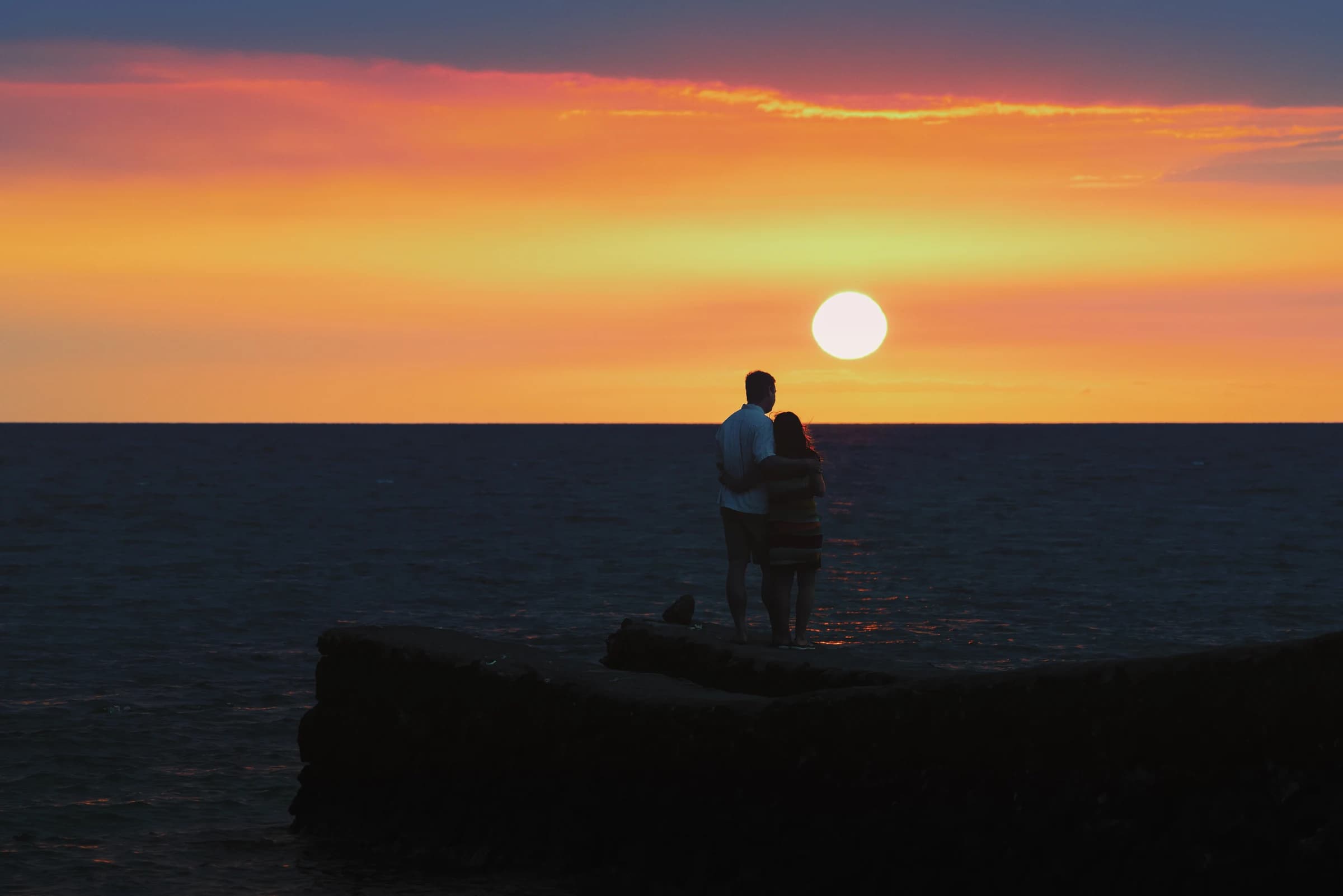 Sunset Embrace by the Sea